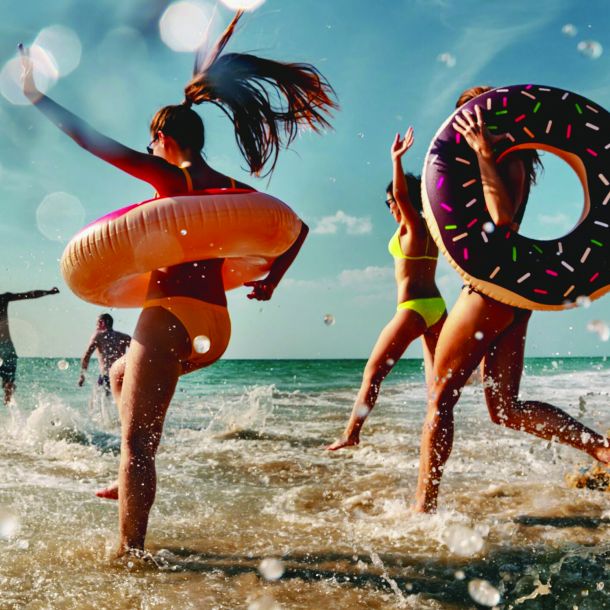 People jumping into the ocean